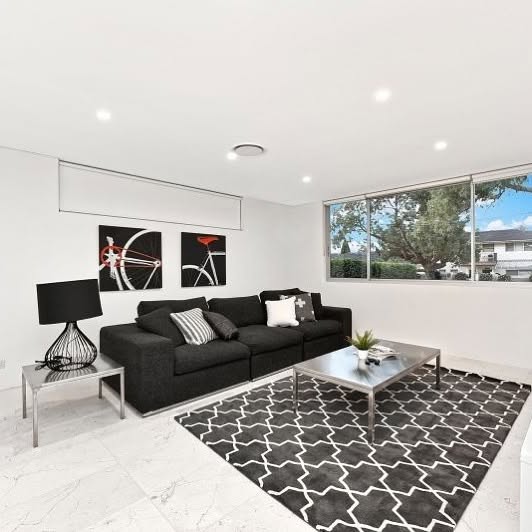 Finished living room with a large window